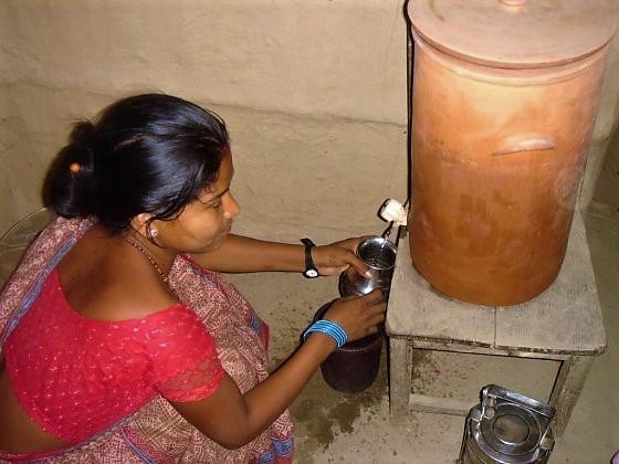 Nepali Women using CSF to treat drinking water. Source: ENPHO (n.y.)