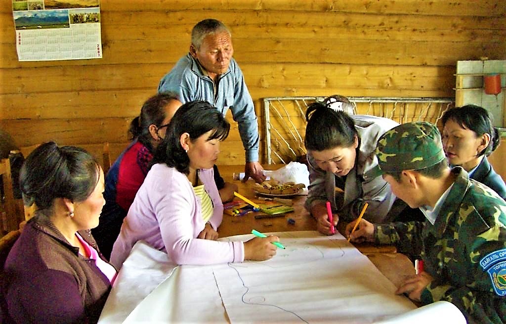 Mongolian community drawing a map of their water resources and water / sanitation related problems. Source: CONRADIN (2008)