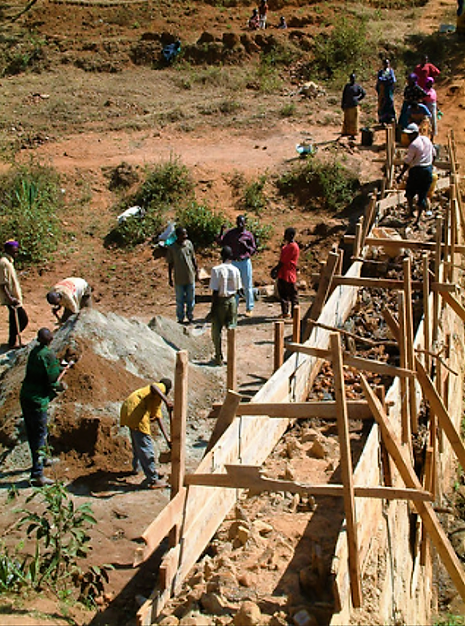 Construction of stone masonry dam in Kenya. Source: THISISEXCELLENT (2003)